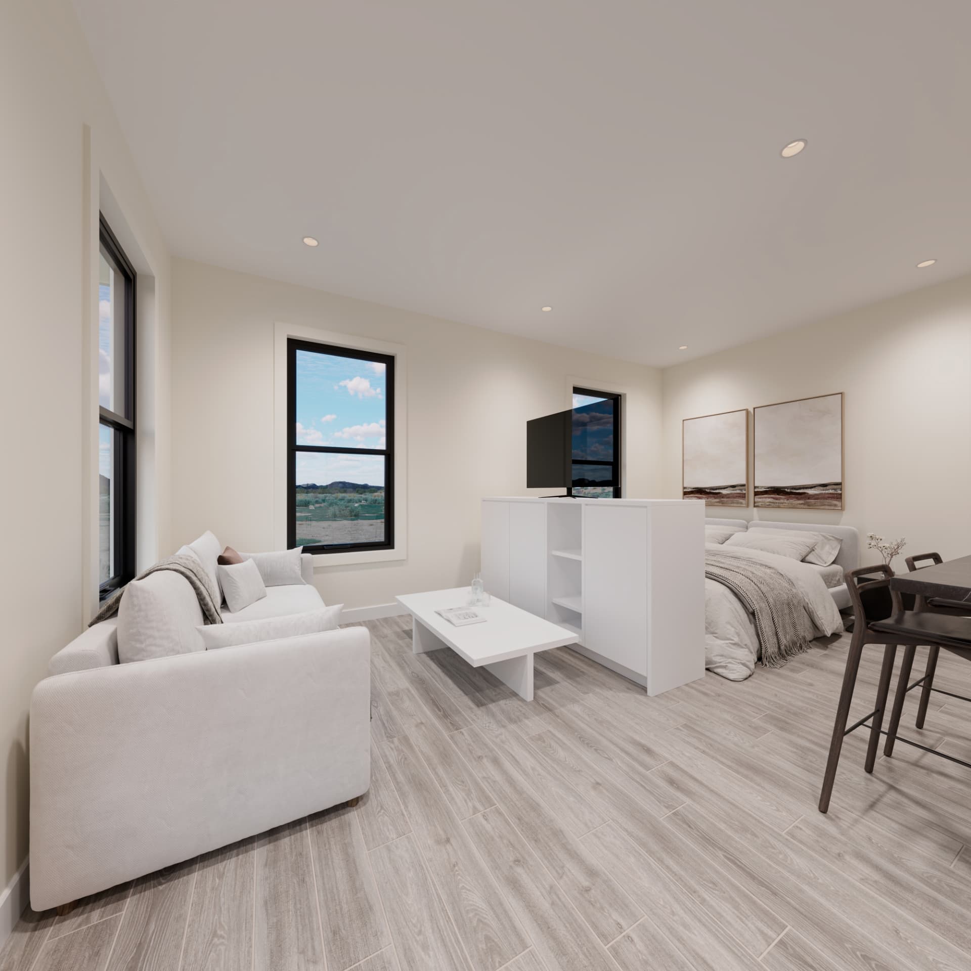 Open studio living area with sofa, bed and dining bar